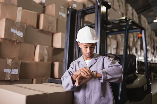 Warehouse worker checking time