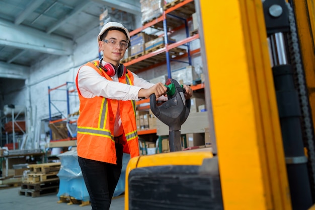 Warehouse worker operates a pallet loader