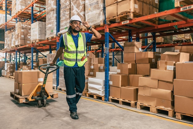 Warehouse worker using parcel pallet in cargo shipping logistics ship supply management employee workplace concept