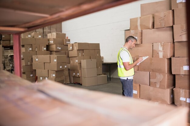 Warehouse worker with clipboard