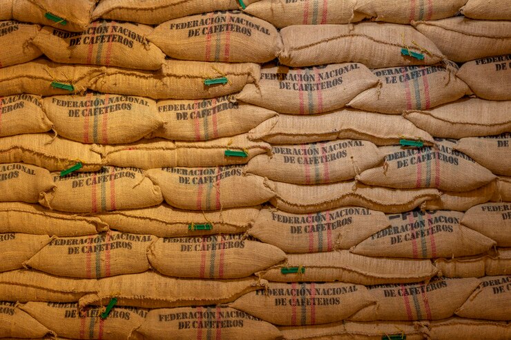 Warehouses where are filling up hemp bags with coffee beans the brand of Colombian coffee