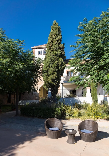 Warm courtyard with table and chairs in Spain