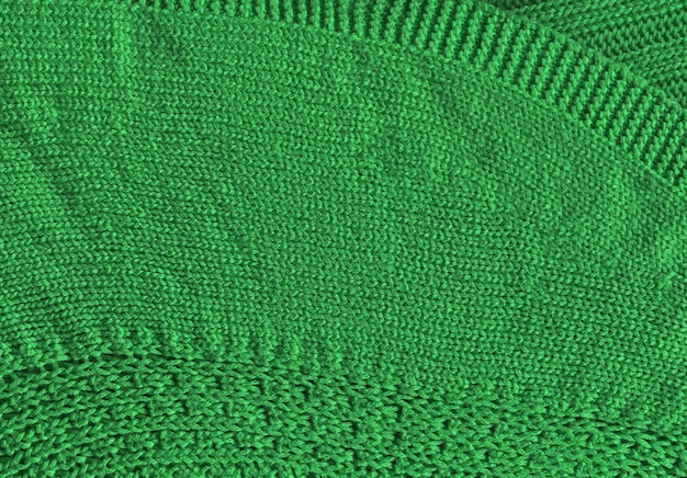 Warm green khaki knitted wool background Beautiful knitted wool textiles as a background