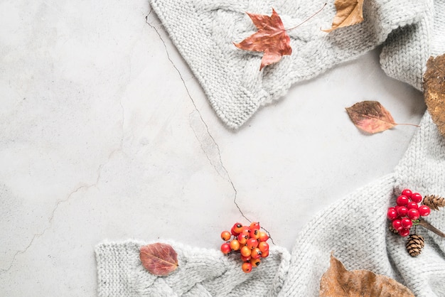 Warm knitted scarf on cracked surface