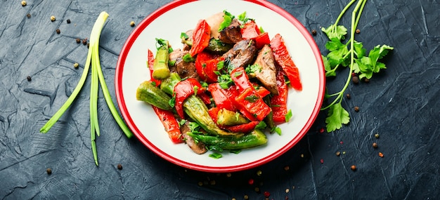 Warm salad with chicken liver and vegetables.Chicken liver salad