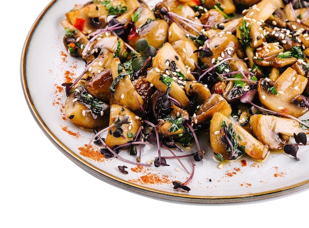 Warm salad with fried mushrooms isolated