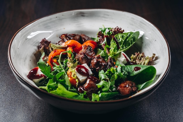 Warm salad with grilled chicken liver Restaurant menu dieting cookbook recipe