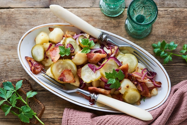 Warm salad with potatoes, bacon and pickles