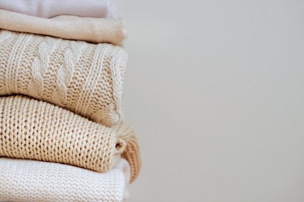 Photo warm sweaters in a pile knitted texture minimalism lifestyle capsule wardrobe autumnwinter season