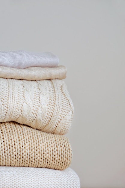 Photo warm sweaters in a pile knitted texture minimalism lifestyle capsule wardrobe autumnwinter season