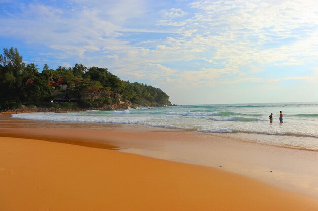 Warm waves of a tropical beach wash the sand