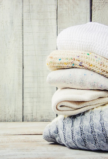 Warm Winter Clothes on a wooden background Selective focus