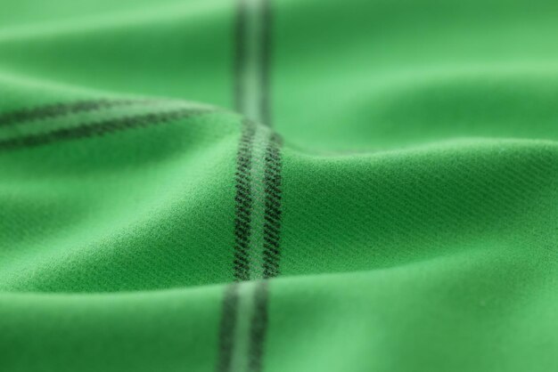 Warme groene kaki gebreide wollen achtergrond met zwarte strepen mooie gebreide wollen textiel met