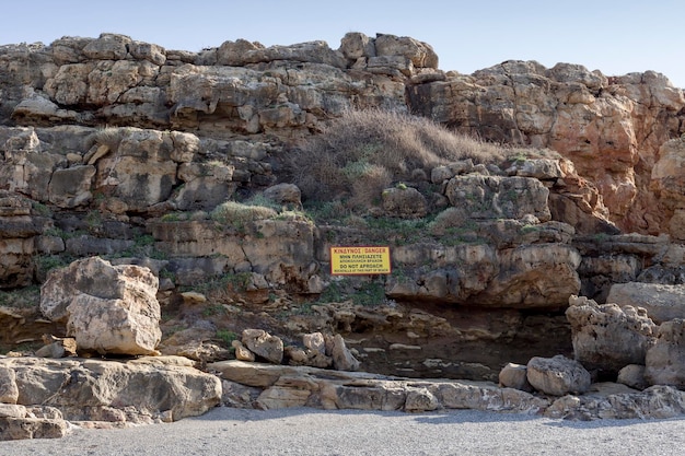 Warning of the danger of falling rocks on the beach