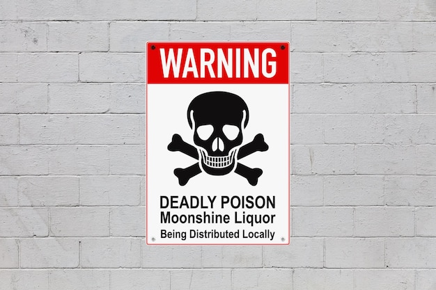 warning deadly poison sign on a cinder block wall