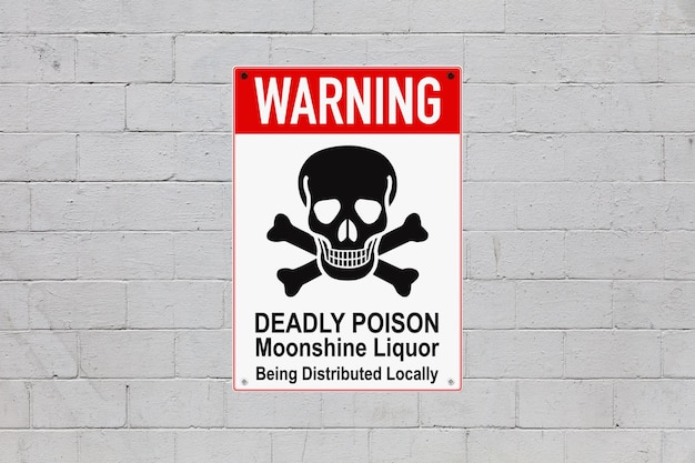 Warning Deadly poison sign on a cinder block wall