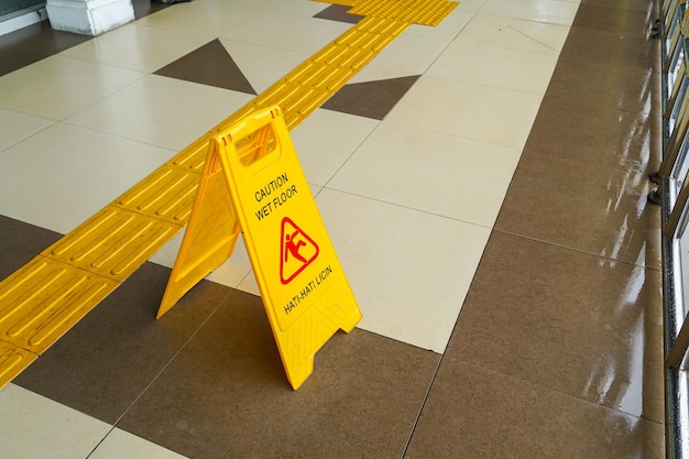 Warning instructions caution sign Wet floor on floor