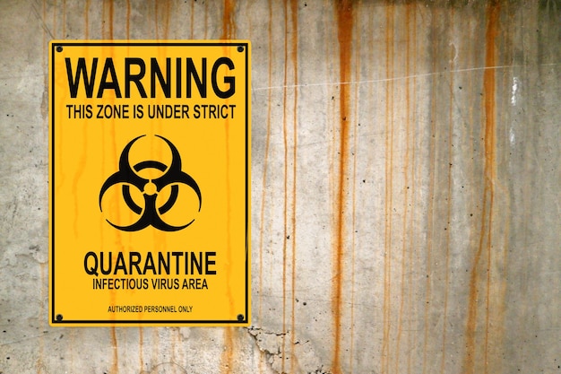 Warning quarantine poster on a concrete wall