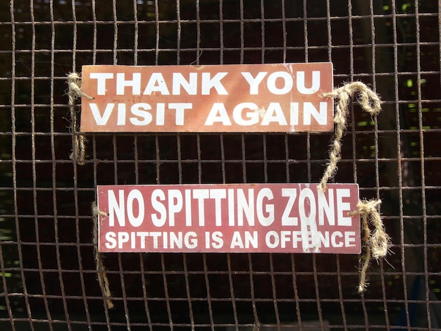 Photo warning sign on fence