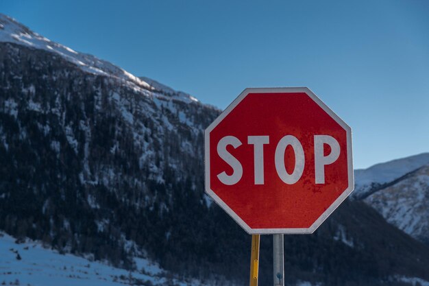 Warning sign on snow covered landscape