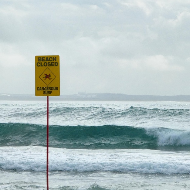 Warning signbeach closed dangerous surf