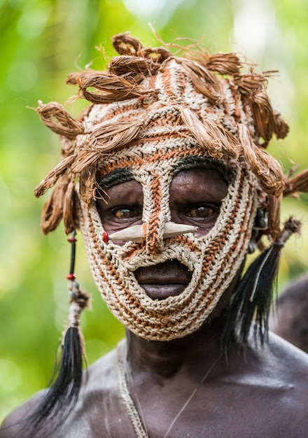 Warrior of the Asmat tribe in ritual mask.