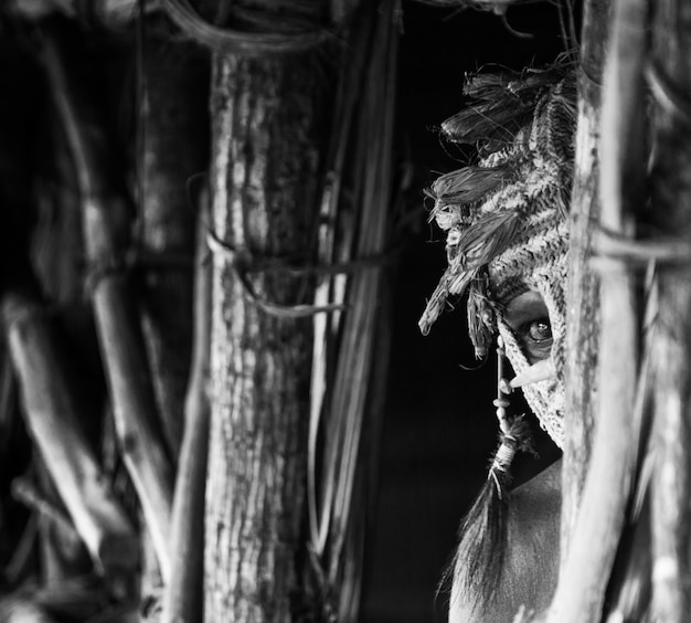 Warrior of the Asmat tribe in ritual mask.