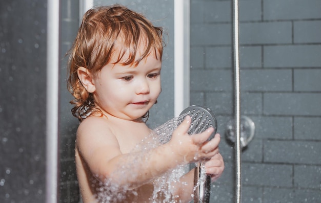 Wash infant hygiene and health care bathing baby happy kid with soap foam on head