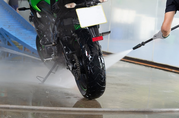 Photo wash the motorcycle at the car wash.