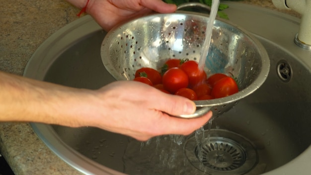 Wash vegetables under the tap. selective focus.Nature.