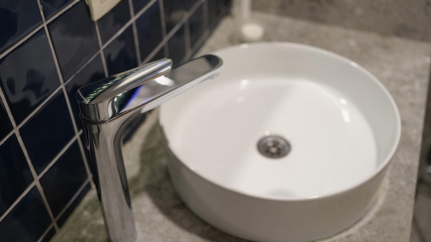 Washbasin and bathroom faucet detail of room interior