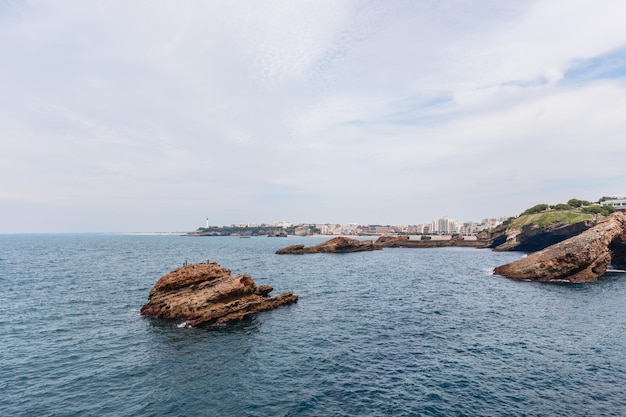 Washed by Biscay Bay waters rock formations with unique texture stand out from sea surface Biarritz