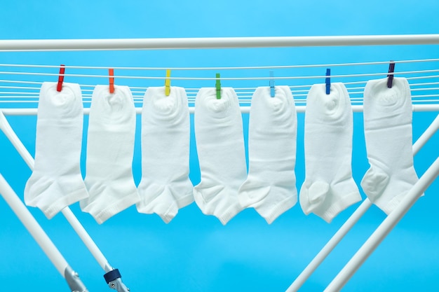 Photo washed white socks are dried in the dryer