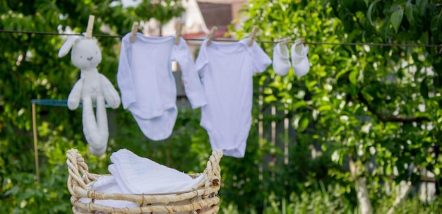 Washing baby clothes Linen dries in the fresh air Selective focus