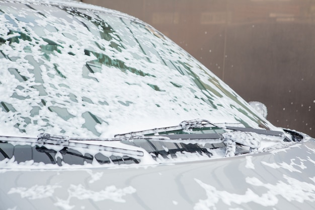 Washing the car with foam in a self-service sink.