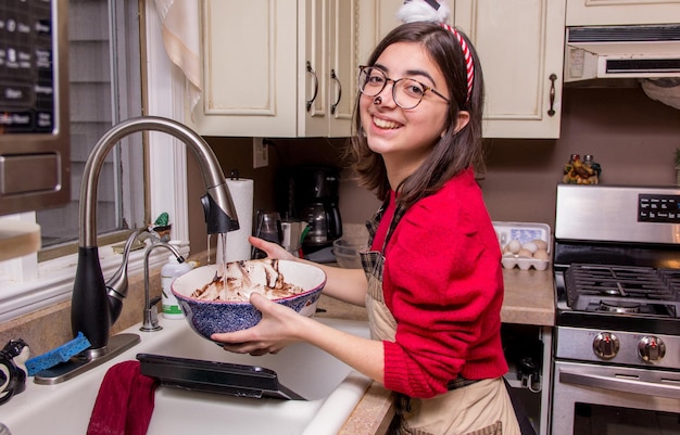 Washing Christmas cookie batter bowl