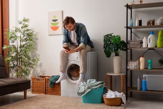 Photo washing clothing in laudry room