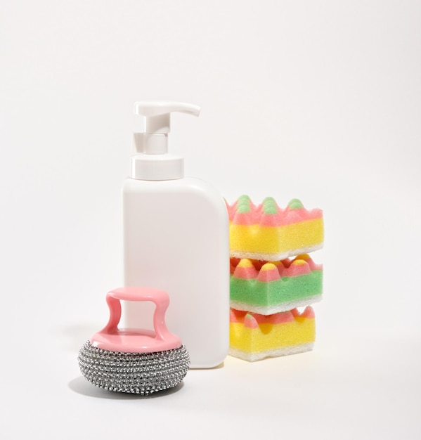Washing dishes with detergent and different sponges Concept of cleanliness