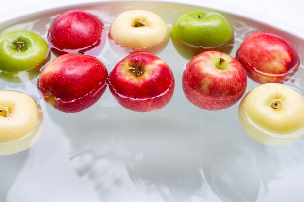 Washing fresh apples in the water