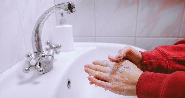 Washing hands rubbing with soap man for coronavirus prevention vintage photo processing