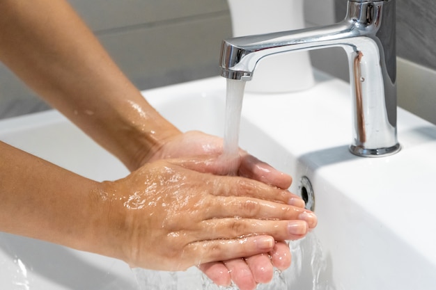 Washing hands rubbing with soap woman for corona virus prevention, hygiene to stop spreading coronavirus