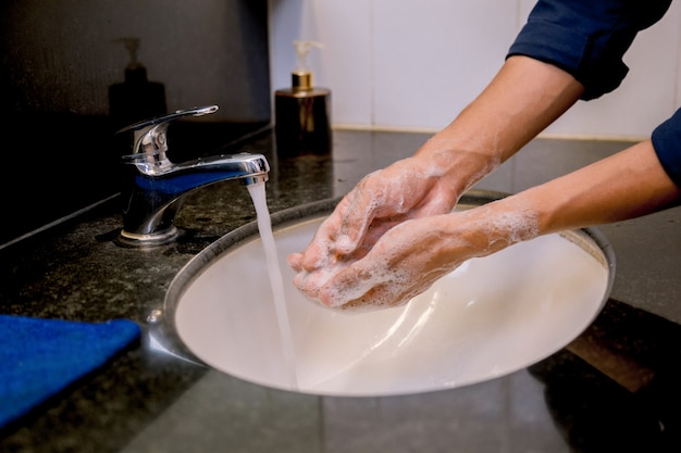 Washing hands rubbing with soap