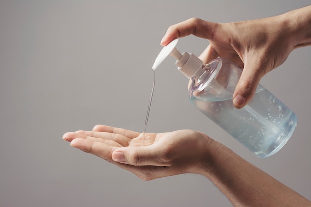 washing hands with alcohol gel anti virus bacteria, dirty skin care hygiene concept.