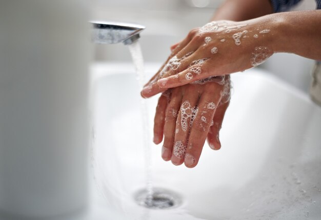 Photo washing hands with thorough rubbing with soap