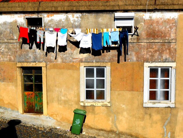 Washing hanging outside house on slope lisbon