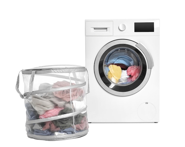 washing machine and basket with laundry on white background