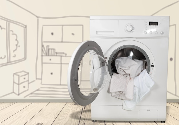 Photo washing machine with laundry on background