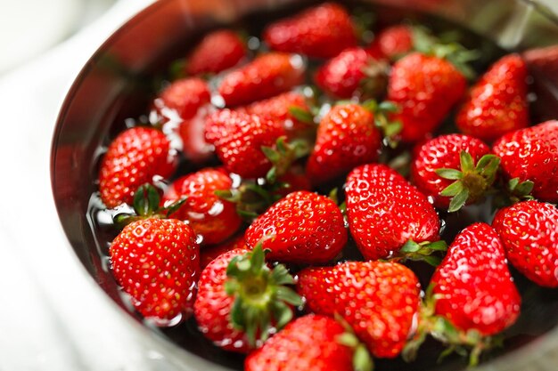 Washing Strawberry in bowl