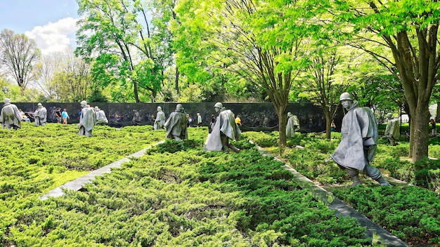 Washington DC, USA - May 2, 2015: Tourists and War Veterans and guardians of Honor Flight nonprofit organization in Korean War Veterans Memorial in West Potomac Park, in the National Mall.