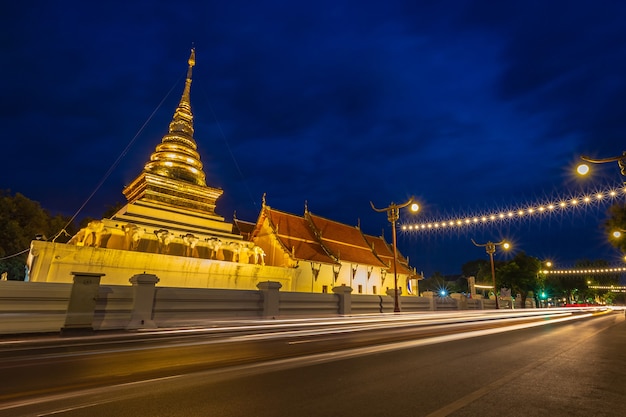 Wat Phra That Chang Kham, Buddhist temple with blue twilight night sky, in Nan Province, North of Thailand.